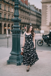 a lady wears a floral printed strap maxi dress